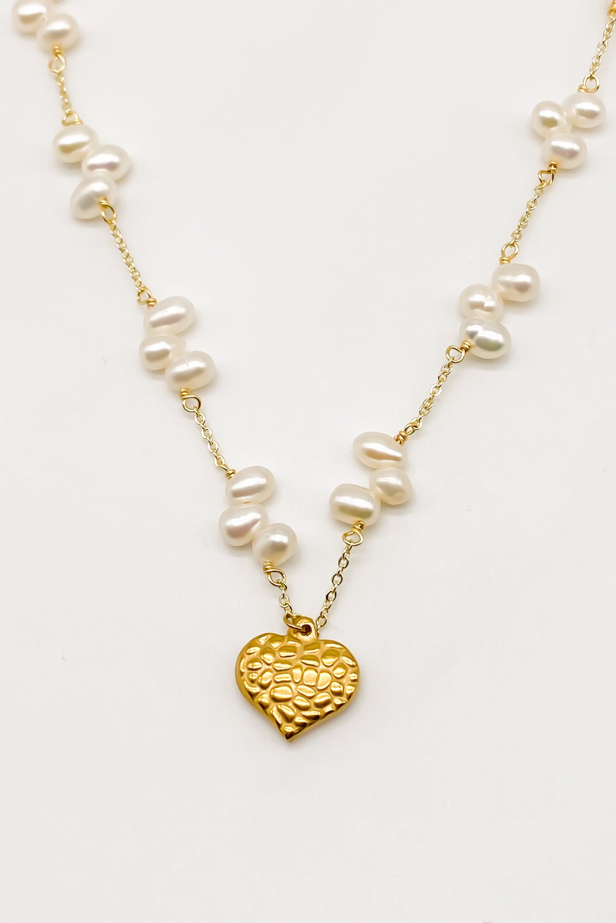 Pearl necklace deals with heart pendant